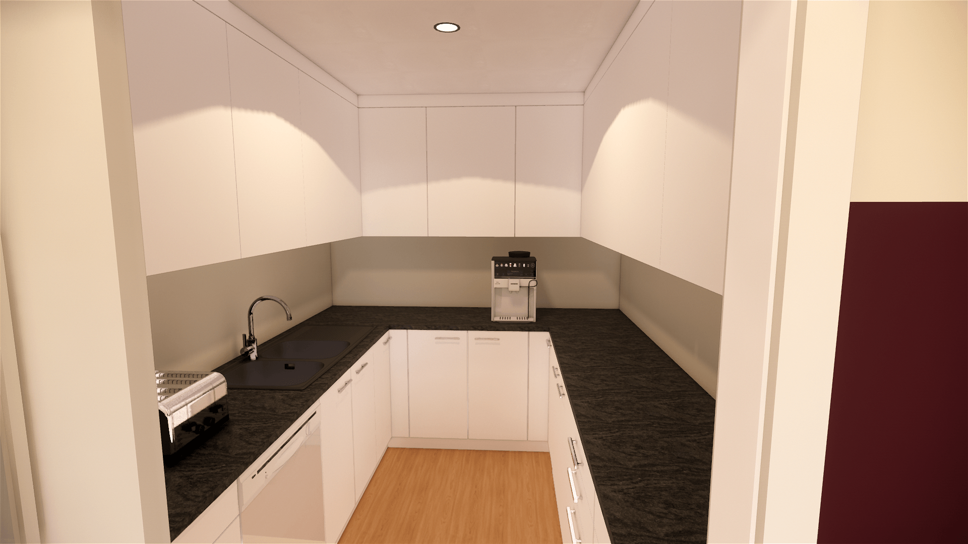A kitchen with black counter tops and white cabinets