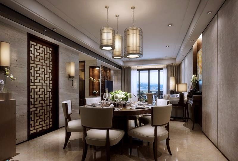 A dining room with a round table and chairs