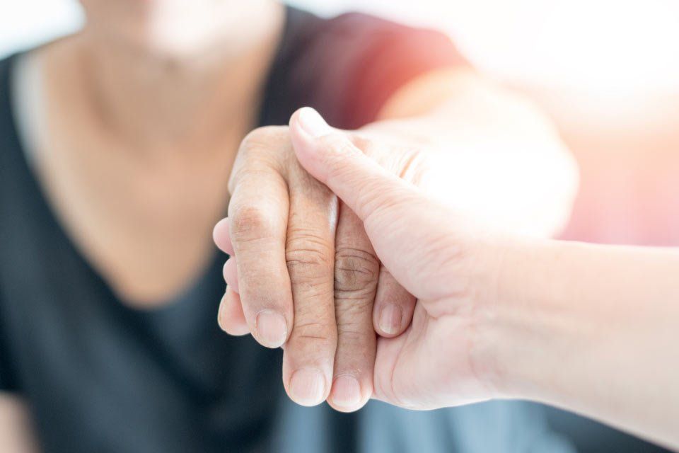 woman holding a hand