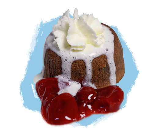 Chocolate lava cake with whipped cream served with strawberry sauce