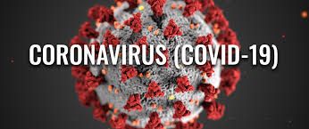 A close up of a coronavirus molecule on a black background.