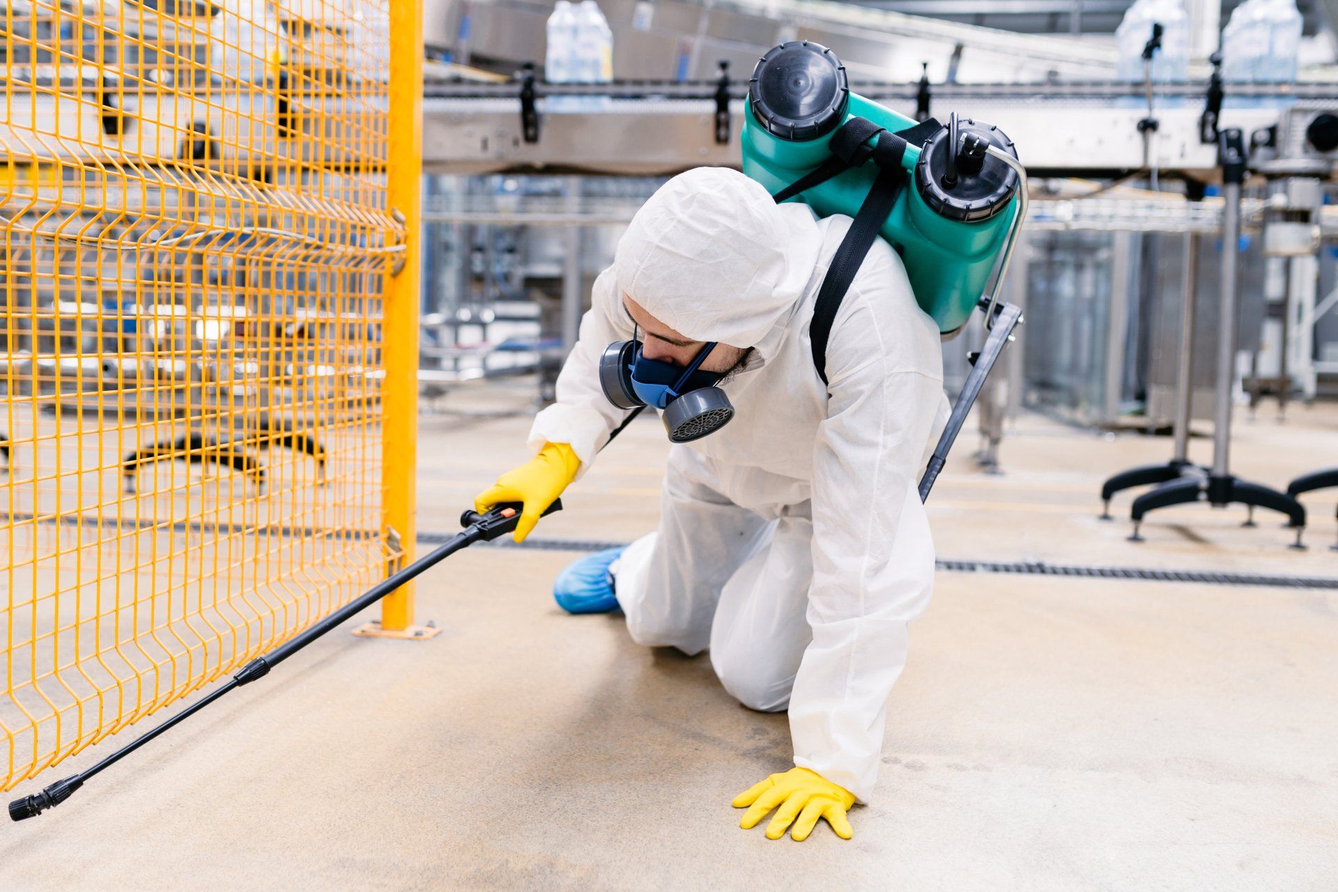 Exterminator In Industrial Plant Spraying Pesticide - Pest Control in Mudgee NSW