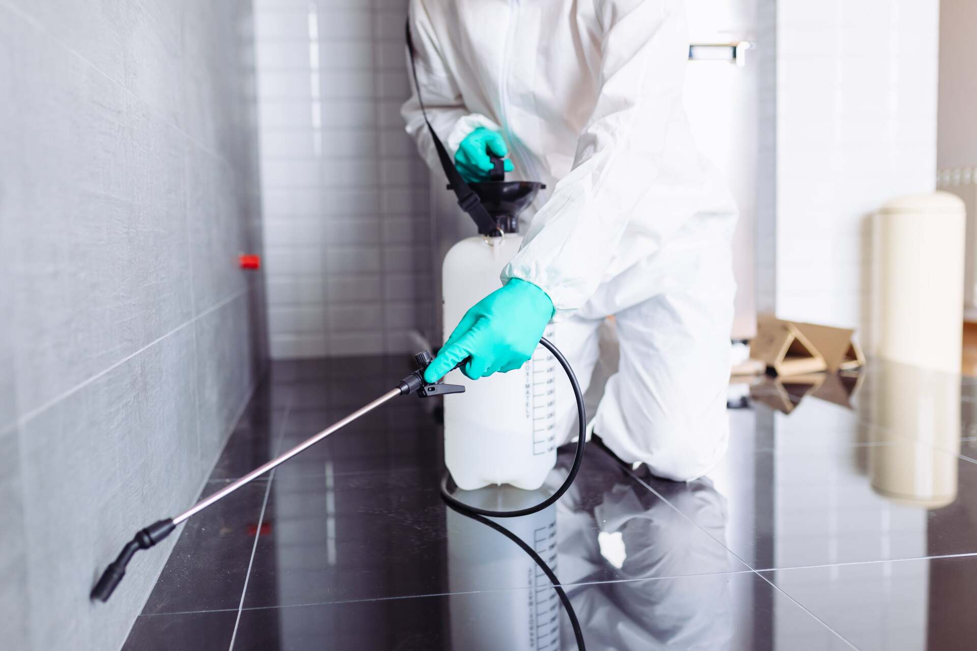 Exterminator In Hazmat Suit Spraying Pesticide - Pest Control in Mudgee NSW