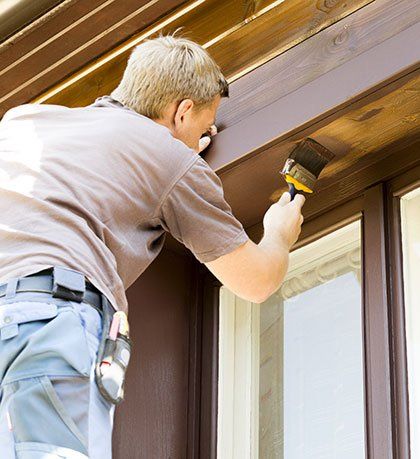 Exterior Painting — Man Painting House Exterior in Seattle, Washington Exterior Painting — Man Painting House Exterior in Seattle, Washington