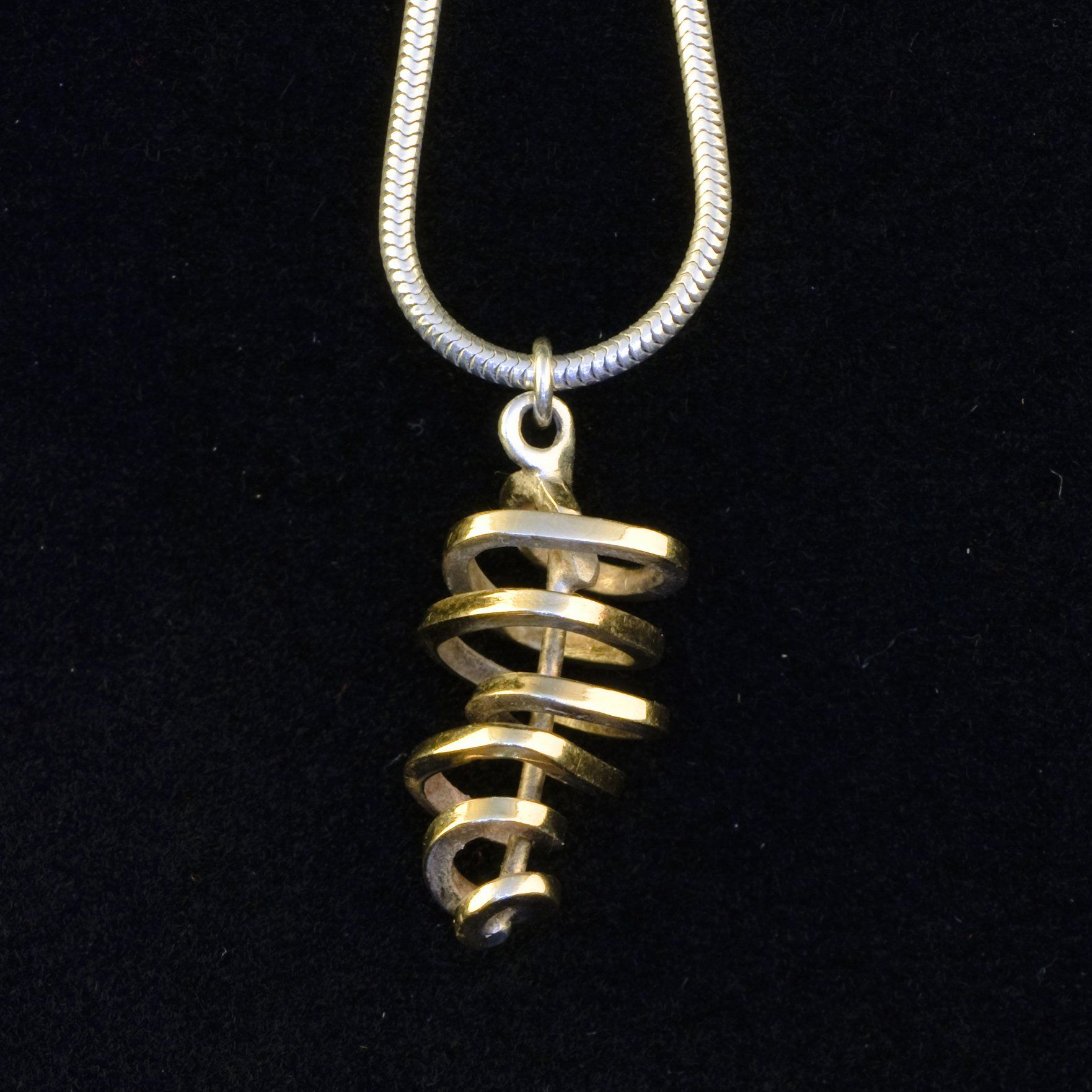 Gold and silver swirl pendant © Libby Day Design