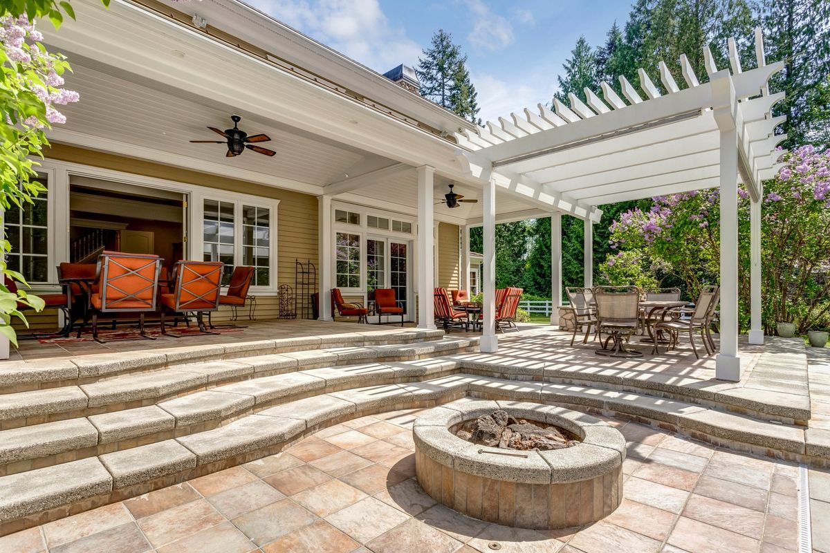 beautiful sunny backyard with pergola