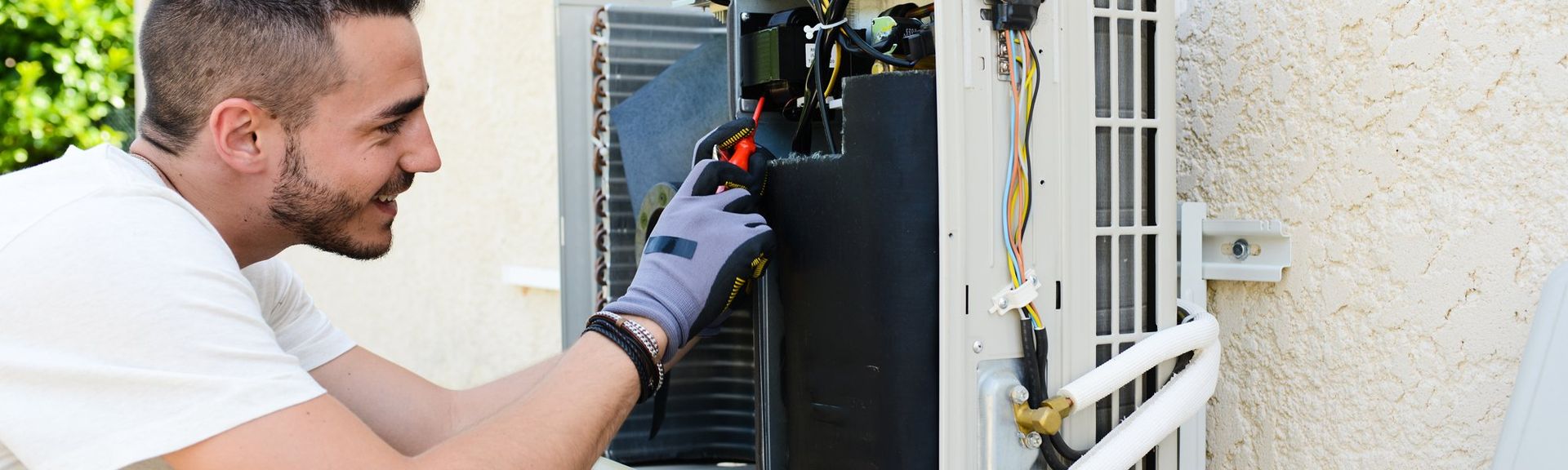 Expert working on repairing the air conditioner