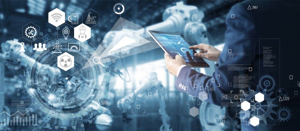 Manager Technical Industrial Engineer working and control robotics with monitoring system software and icon industry network connection on tablet. AI, Artificial Intelligence, Automation robot arm.