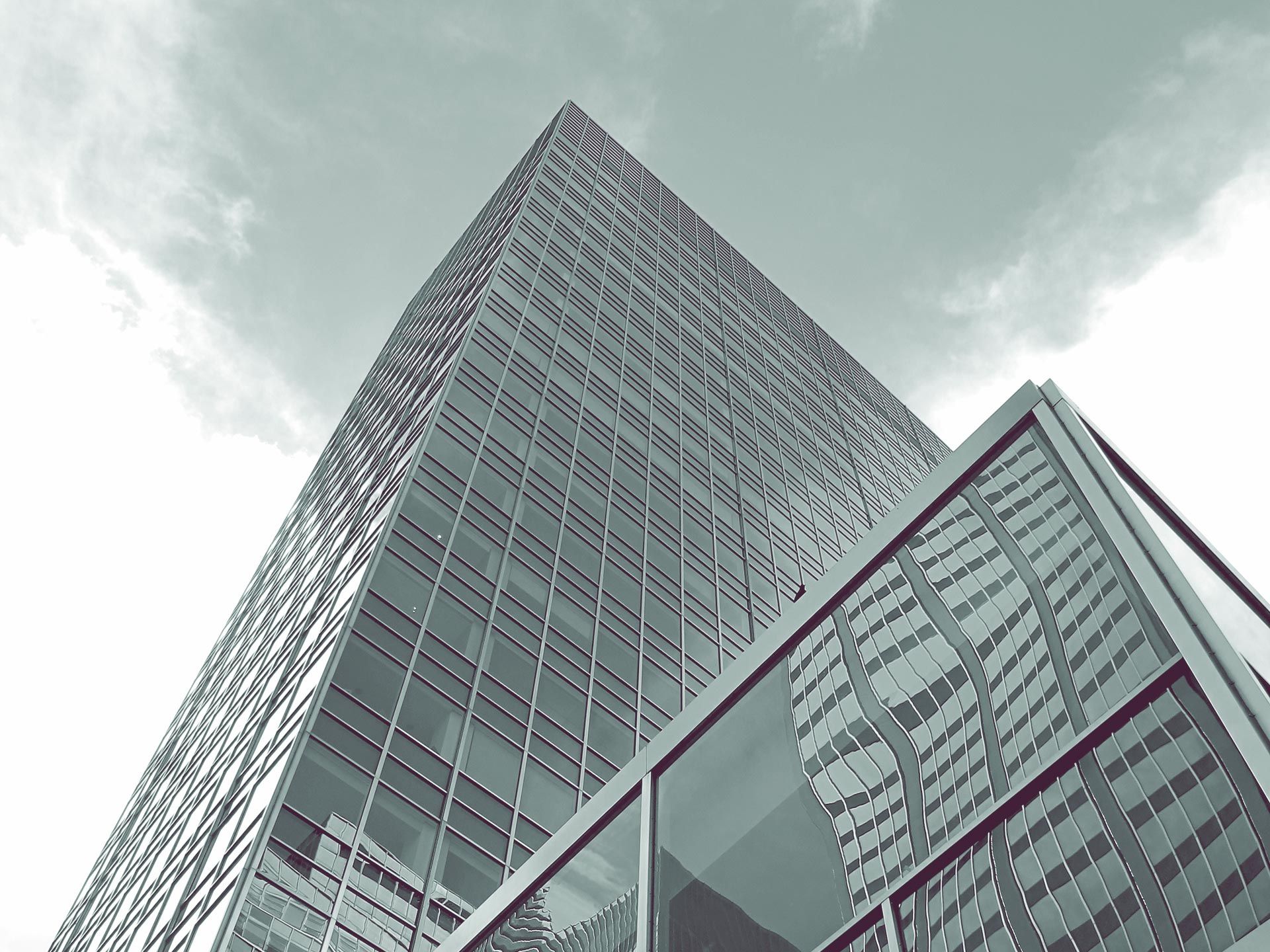 Looking up at a tall building with the word ibm on it