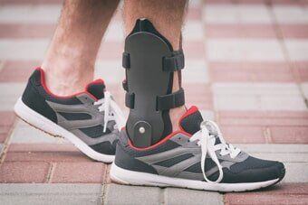 Man wearing ankle brace – Personalized Orthopedics ni Albany, NY Man wearing ankle brace – Personalized Orthopedics ni Albany, NY