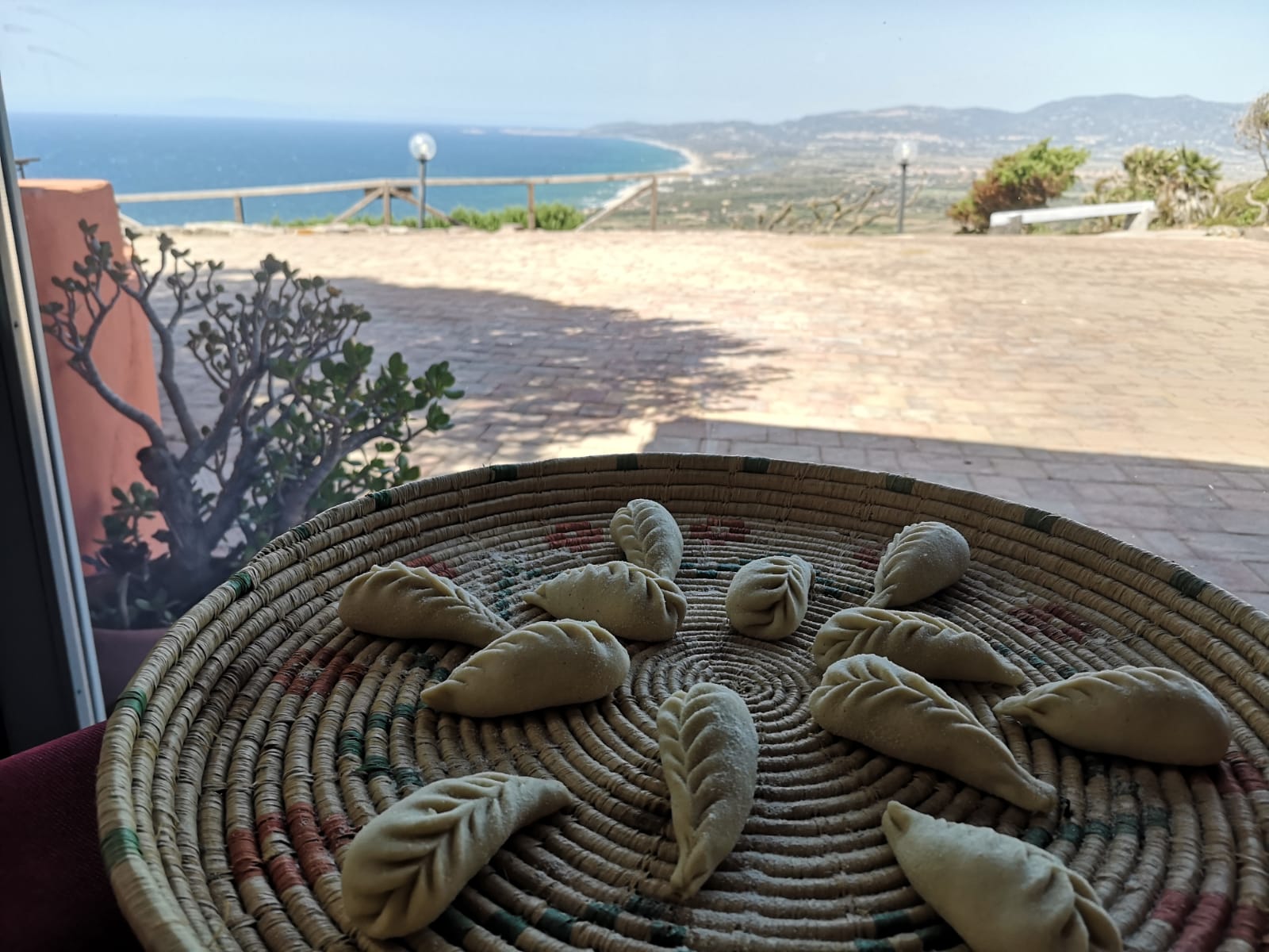 Sardinian culurgiones with a sea view