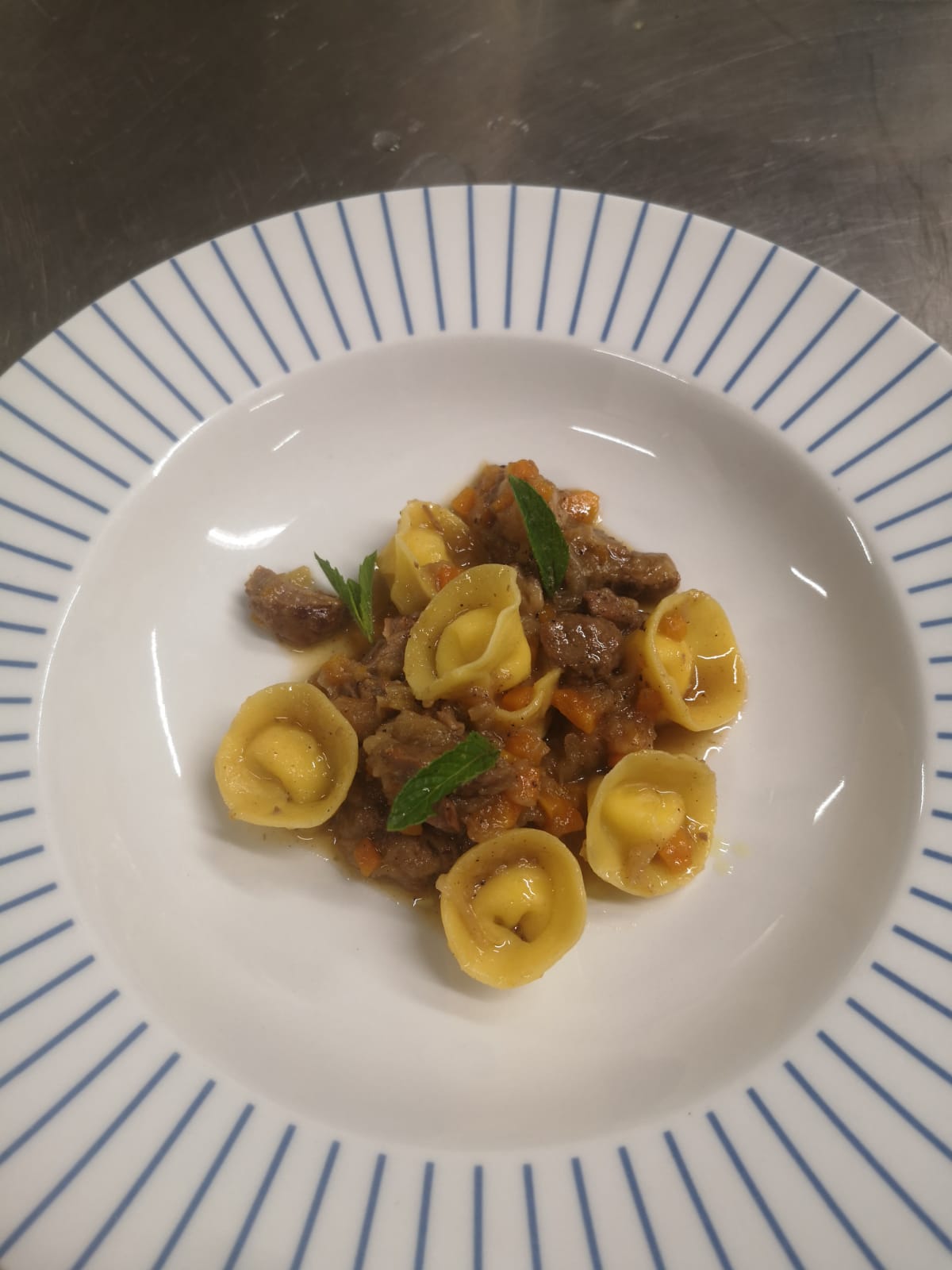 tortelli with meat and bay leaves
