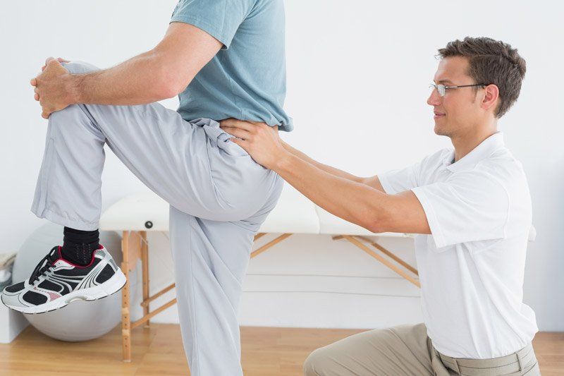 doctor helping patient