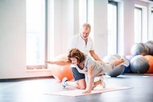 physiotherapist working with woman