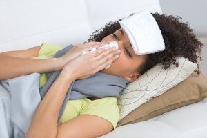 woman with a cold in bed