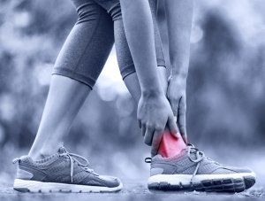 person experiencing ankle pain