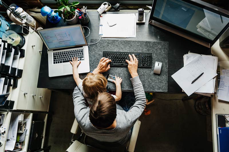 man and daughter at desk