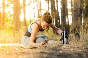 woman stretching before run