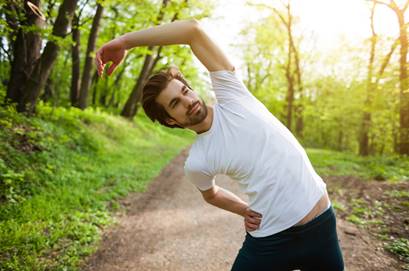 man stretching outside