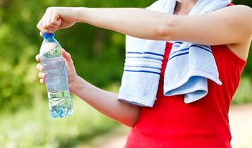 person opening water bottle