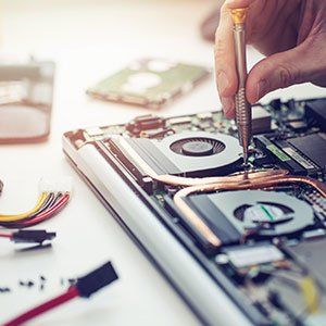 Computer Repair — Technician Repairing Laptop in Fairdale, KY Computer Repair — Technician Repairing Laptop in Fairdale, KY