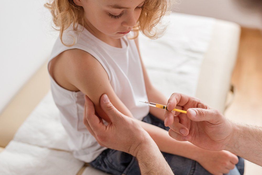 Doctor Injecting a Shot of Vaccine to a Patient — Memphis, TN — Vaccine Injury Lawyers Doctor Injecting a Shot of Vaccine to a Patient — Memphis, TN — Vaccine Injury Lawyers