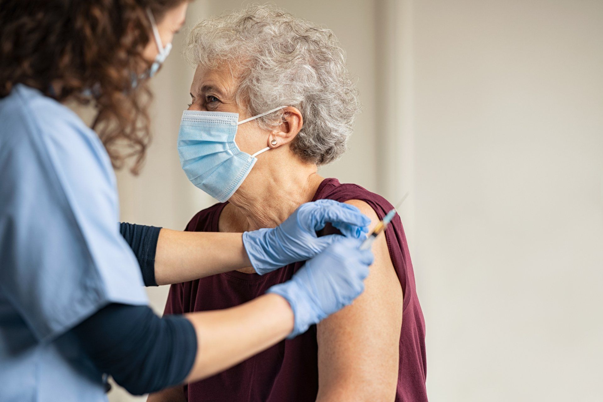 Hands with Gloves Injecting a Vaccine — Memphis, TN — Vaccine Injury Lawyers Hands with Gloves Injecting a Vaccine — Memphis, TN — Vaccine Injury Lawyers