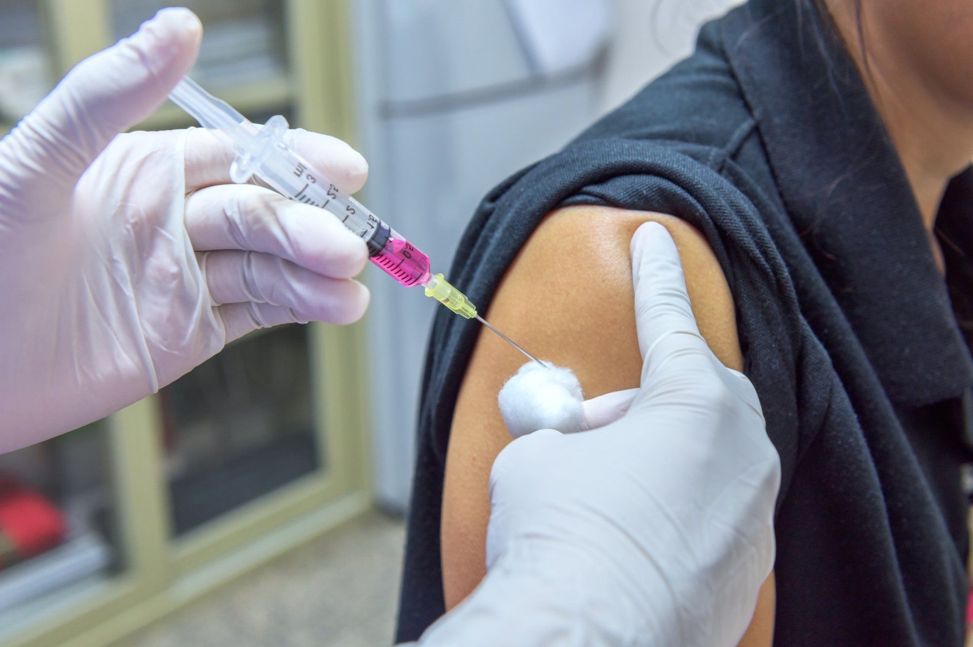 Doctor Vaccinating A Woman — Memphis, TN — Vaccine Injury Lawyers Doctor Vaccinating A Woman — Memphis, TN — Vaccine Injury Lawyers