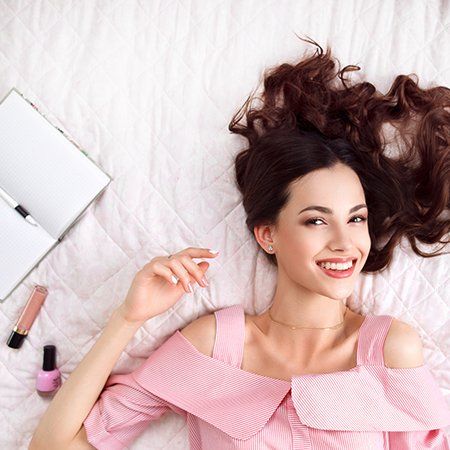 Beauty — Happy Woman On Bed With New Hair Style In Milmont Park, PA Beauty — Happy Woman On Bed With New Hair Style In Milmont Park, PA