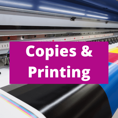 A purple sign that says copies and printing on it