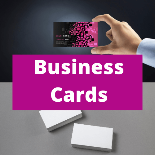 A person is holding a business card in their hand.