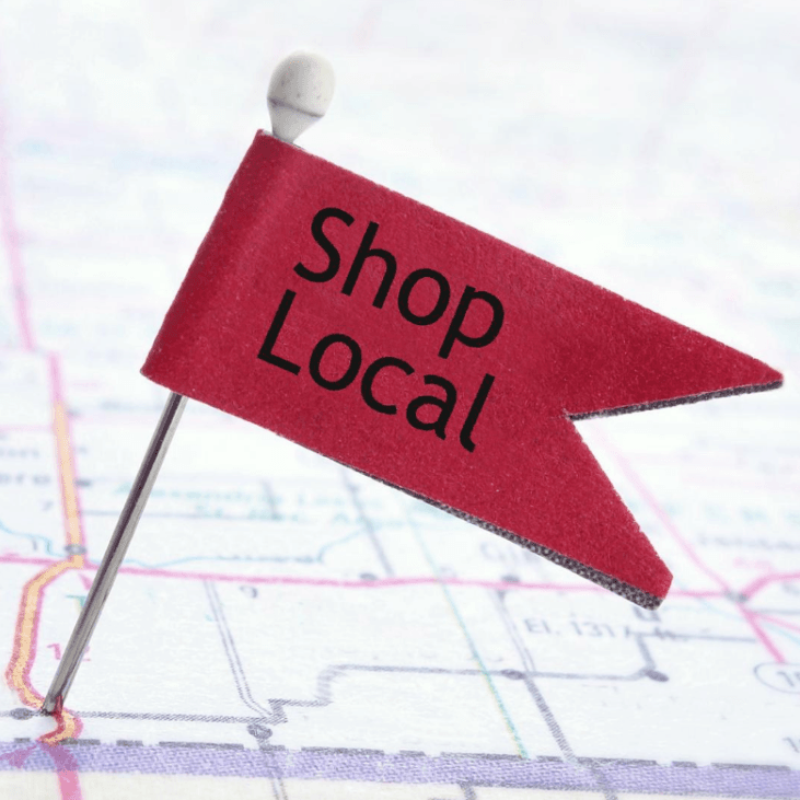 A small red flag with shop local written on it