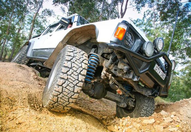 white jeep on dirt