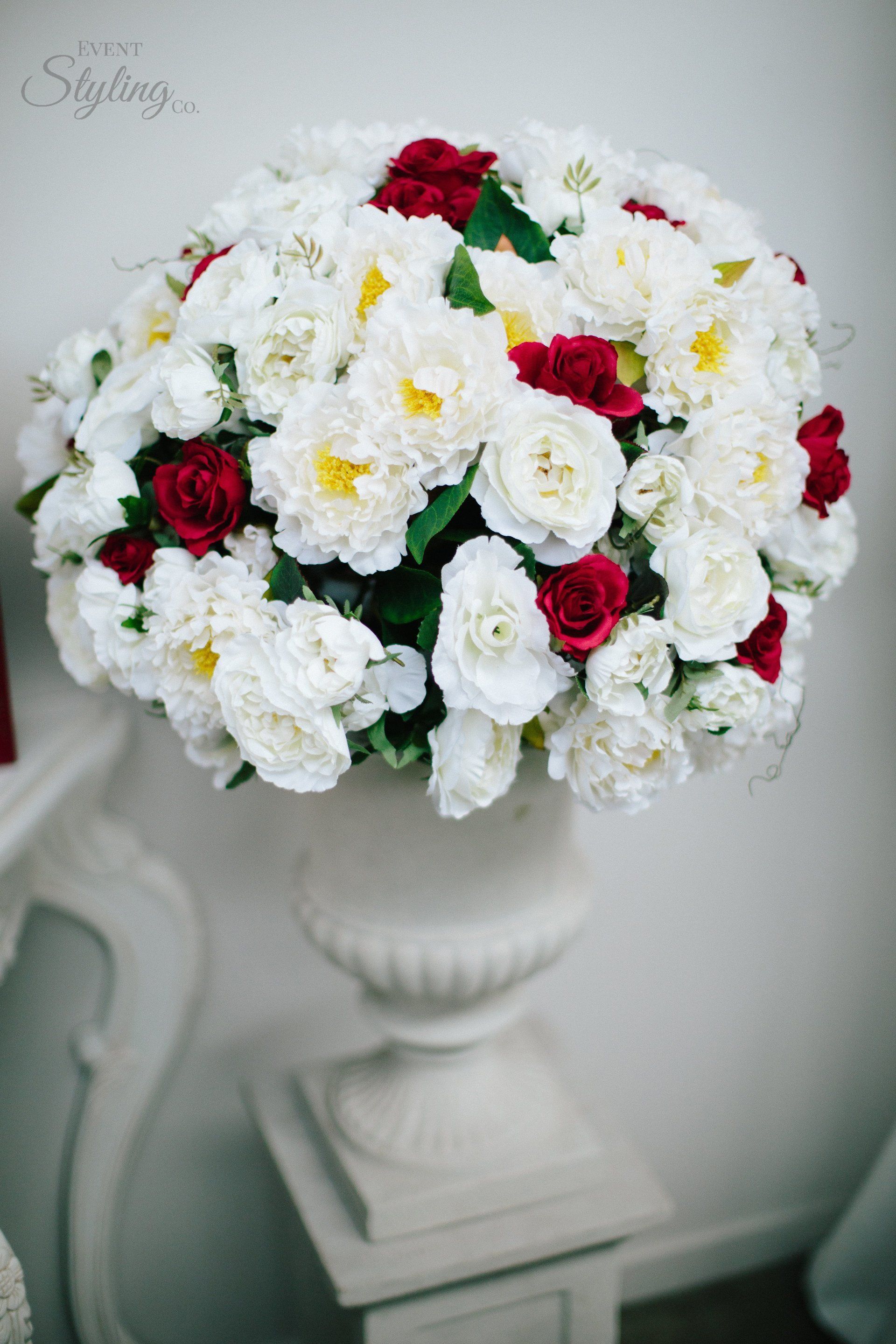 White wash urn with flowers