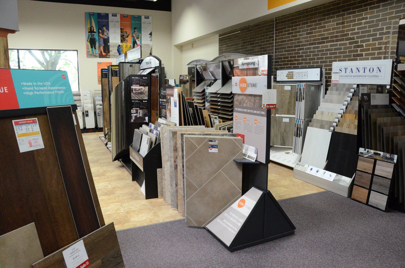 Flooring store showroom with sample boards and carpet displays along the walls