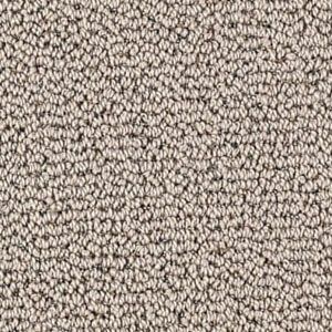 Close-up of beige and brown textured carpet fibers