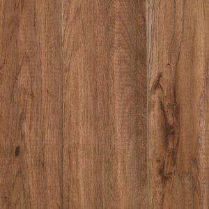 Close-up of brown wood grain with a vertical seam and knot detail
