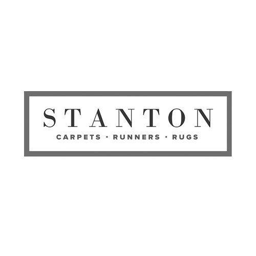 Stanton logo in a gray framed rectangle, with “Carpets · Runners · Rugs” beneath the name