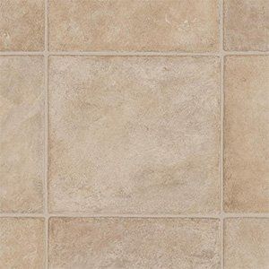 Beige ceramic tile floor with grout lines and subtle stone texture
