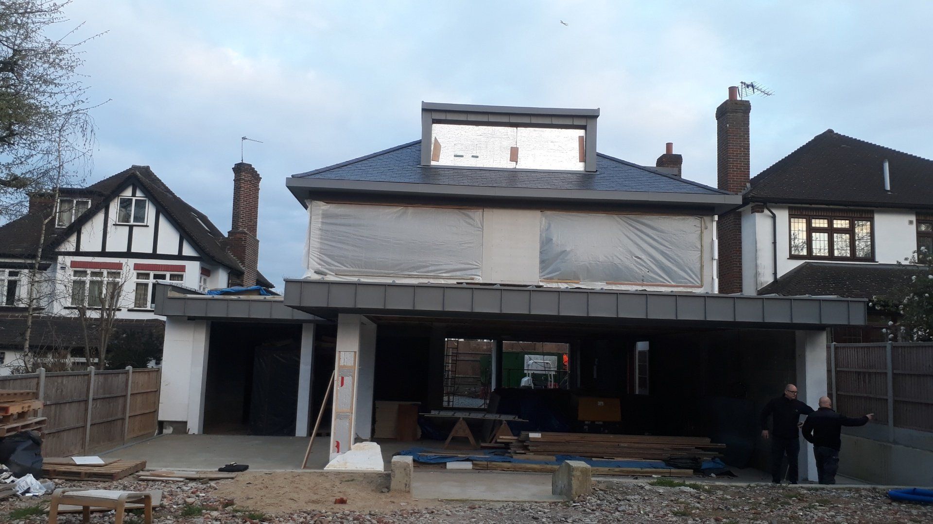 A house is being built in the middle of a residential area.