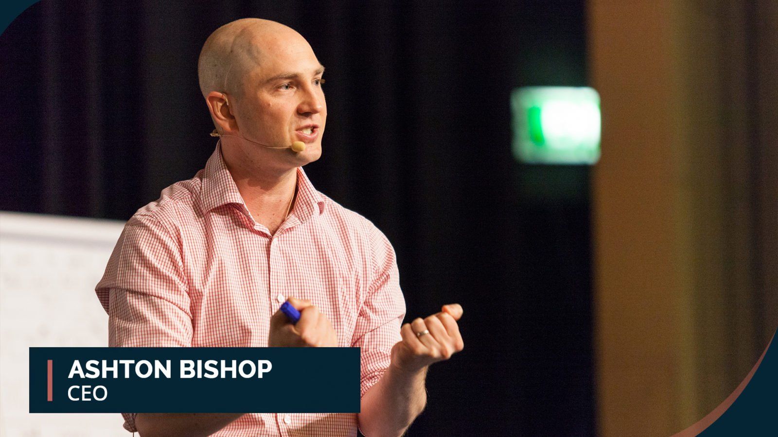 Ashton Bishop on stage giving a talk