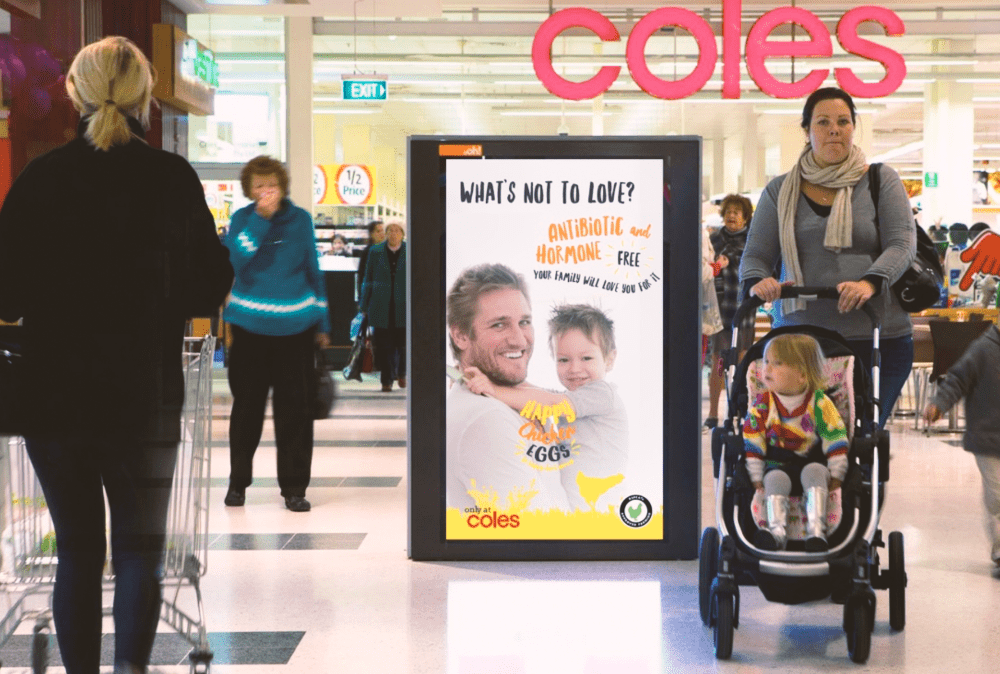 A Happy Chicken Eggs poster in a shopping centre