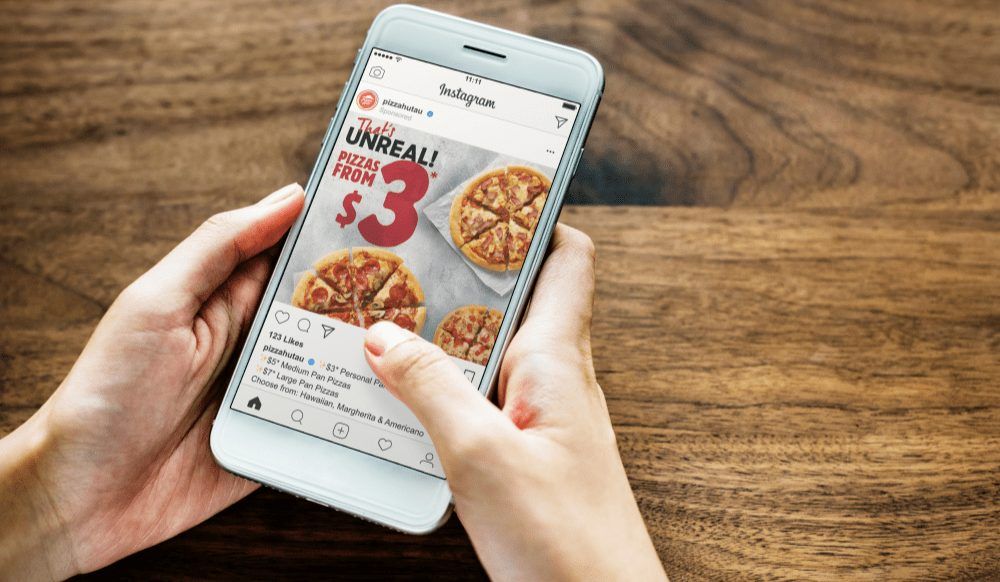 Someone looking at a Pizza Hut ad on Instagram