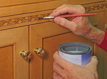 Palm Desert — Closeup of Painter Apply Vanish to Inlaid Trim in Palm Desert, CA