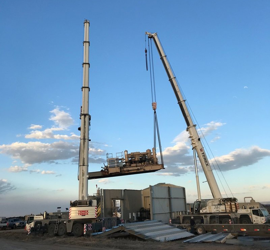 Worker with Helmet Operating a Crane — Vernal, UT — J&C Enterprises Inc. Worker with Helmet Operating a Crane — Vernal, UT — J&C Enterprises Inc.