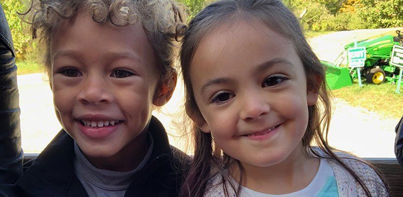 Two smiling kindergarten aged children