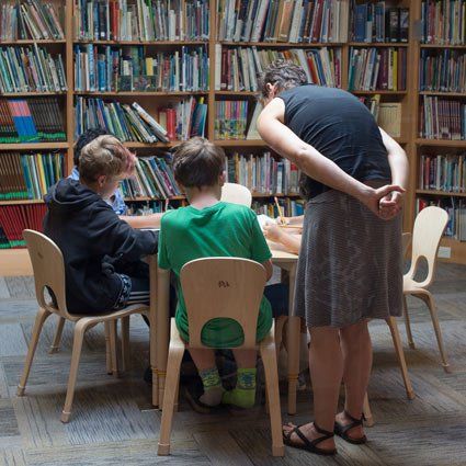 guide with students in the library