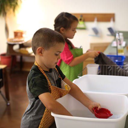 Children's House students doing jobs