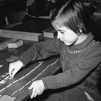 historical Montessori student with bead chains