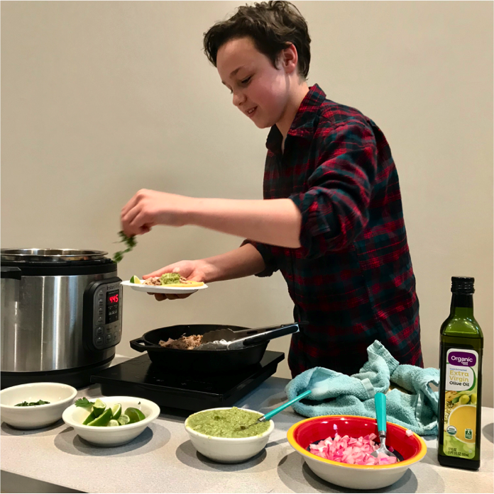 Adolescent serving up chili